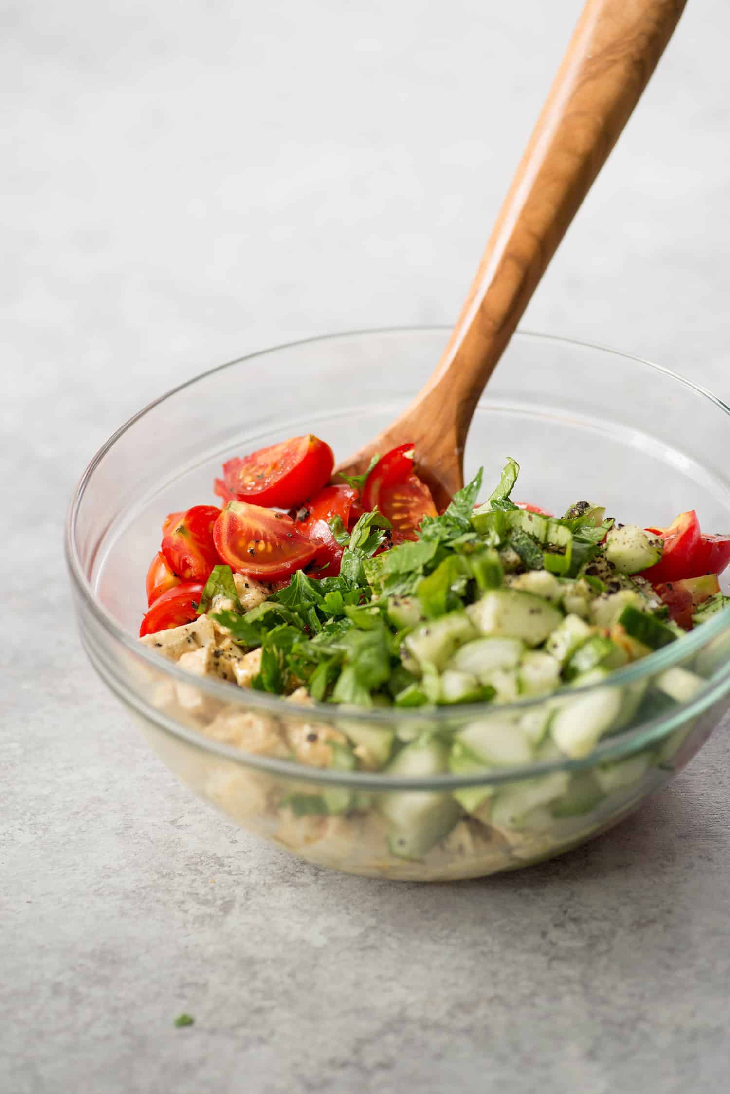 Simple Tomato and Tofu Vegan Feta Salad 1 Simple Tomato And Tofu Feta Salad With Wooden Spoon